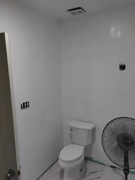 After: smooth, freshly painted walls