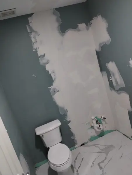 Before: walls patched with mud